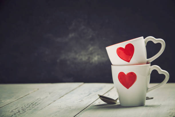 istock Valentine's Day concept. Red Cups on a Wooden Background. 1125356810