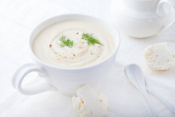 cauliflower soup on a white background. healthy food. - cauliflower vegetable portion cabbage imagens e fotografias de stock
