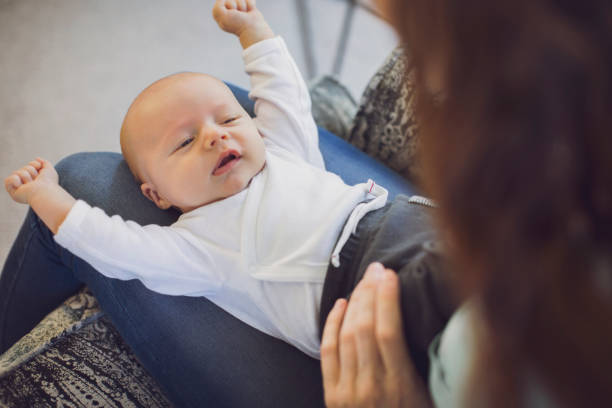 istock Redhead mother with newborn son stretching at home 1125359109
