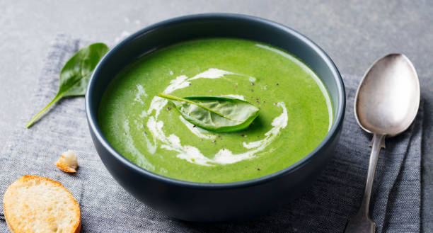 istock Spinach soup with cream in a bowl. Close up. 1125359599