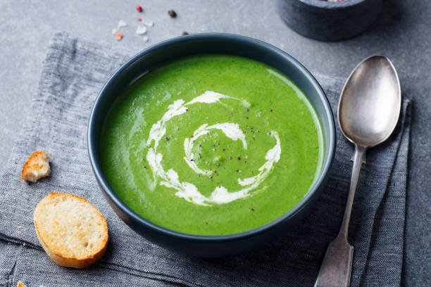 istock Broccoli cream soup in a bowl with toasted bread. Go green concept 1125360681