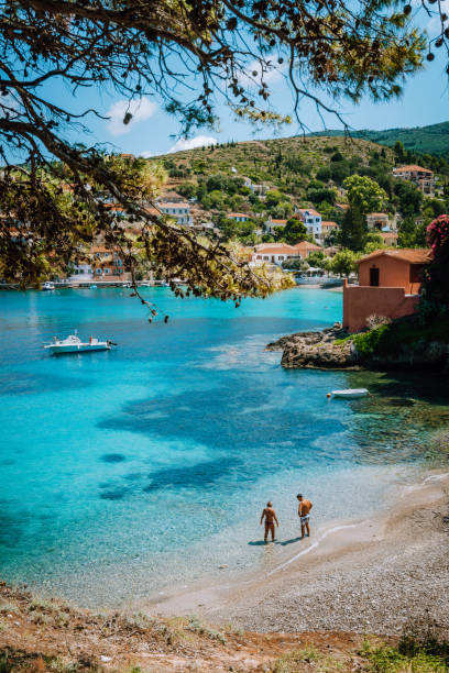 People on summer holiday on beautiful idyllic beach in Kefalonia island of Greece - Europe People on summer holiday on beautiful idyllic beach in Kefalonia island of Greece - Europe. kefalonia stock pictures, royalty-free photos & images