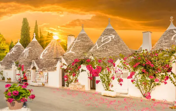 Trulli houses in Alberobello city at sunset time,  Apulia, Italy
