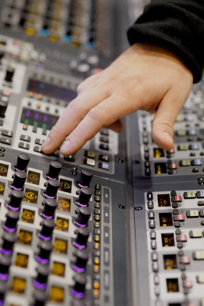 istock sound engineer working on music mixer console 1125365891