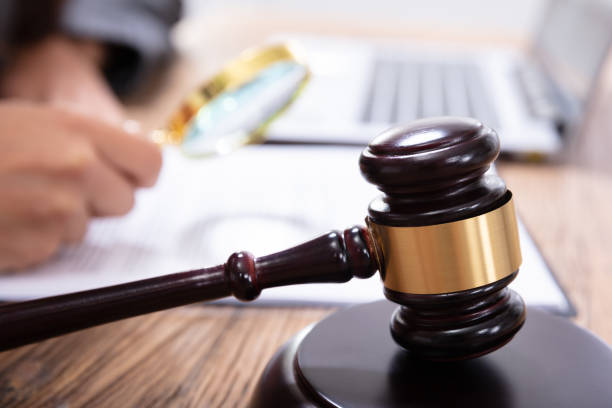 istock Mallet In Front Of A Judge Analyzing The Invoice 1125366078