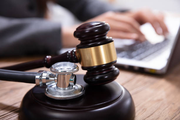 istock Mallet And Stethoscope On Gavel Over The Office Desk 1125366081