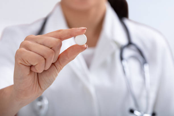 istock Female Doctor Holding White Tablet In Hand 1125366130