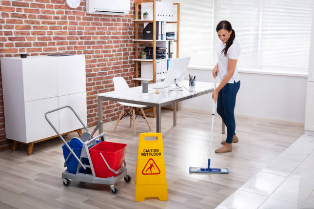 istock Smiling Female Janitor Cleaning Floor 1125366165