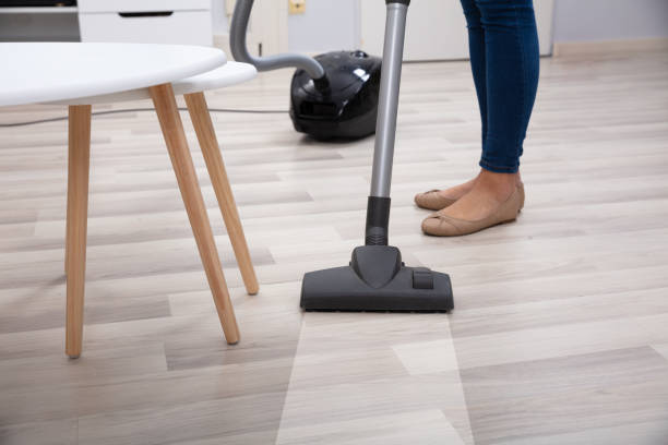 istock Person Using Vacuum Cleaner For Cleaning Floor 1125366222