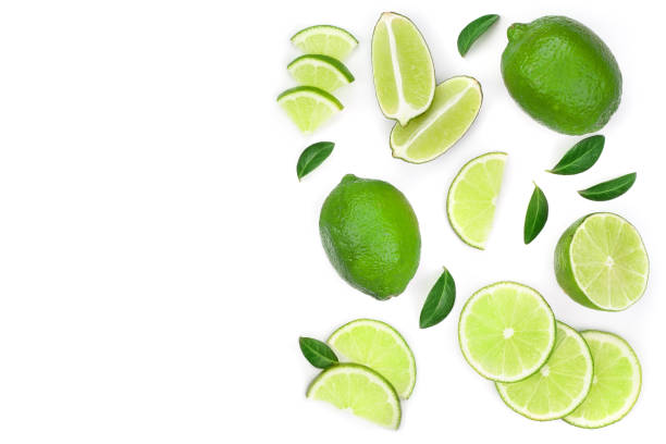 istock sliced lime vith leaves isolated on white background with copy space for your text. Top view. Flat lay pattern 1125367330