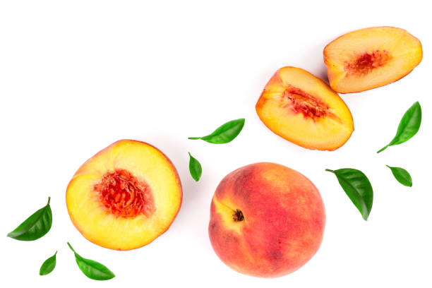 istock ripe peaches with leaves isolated on white background with copy space for your text. Top view. Flat lay pattern 1125367354