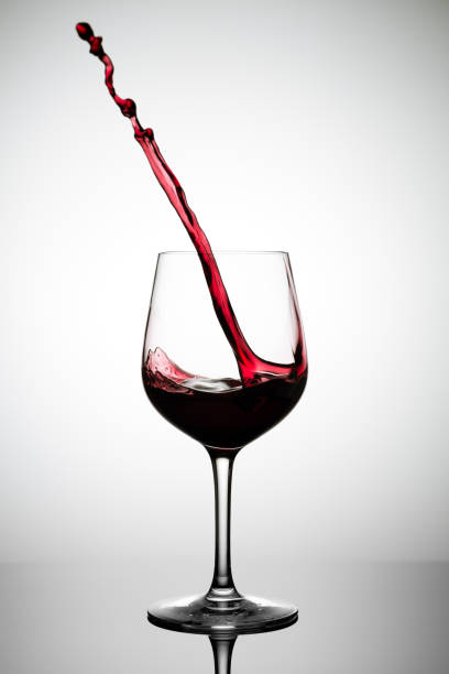 istock red wine splashing out of a glass 1125367435