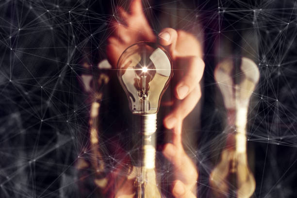 istock man hand choose glow light bulb with virtual line connected creativity business ideas concept black background 1125370014