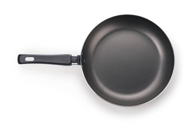 Black frying pan isolated on white with clipping path Black frying pan top view. Isolated on white, clipping path included cooking pan overhead stock pictures, royalty-free photos & images