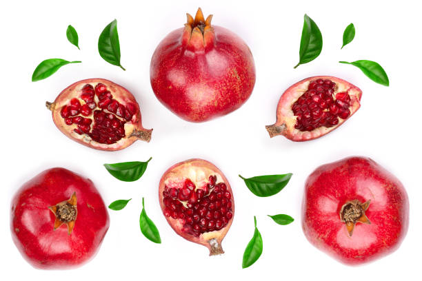 istock pomegranate with leaves isolated on white background. Top view. Flat lay pattern 1125371044