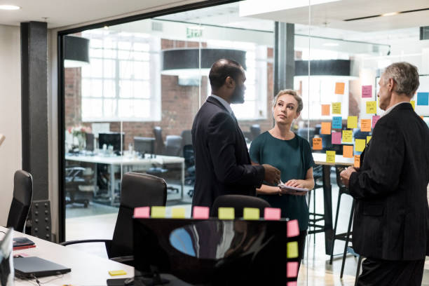 istock Multi-ethnic colleagues discussing in board room 1125371964