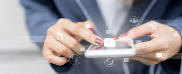 close up manager businesswoman hand touch screen on smartphone device for receive unread e-mail list or send mail to partner and customer , virtual reality interface technology concept with virtual reality interface