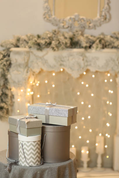 istock chriatmas silver gift boxes with garlandas lights 1125375848