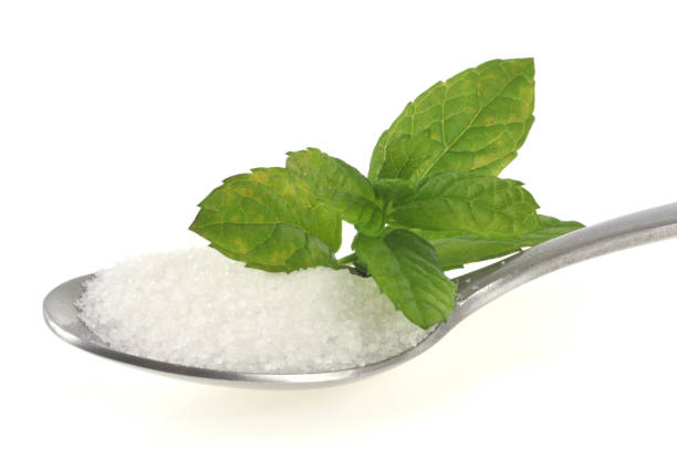 istock Powdered sugar spoon with stevia leaves 1125378737