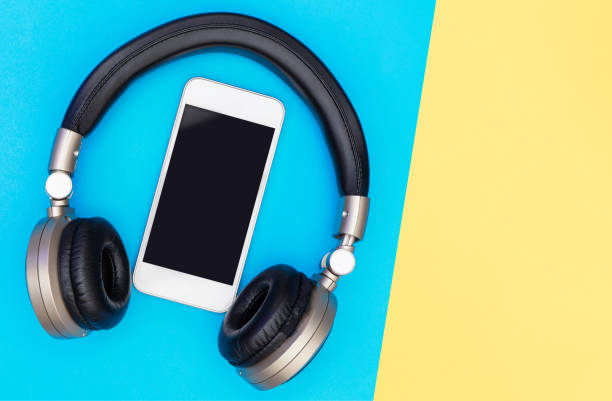 istock Blank Mobile phone screen inside of Golden headphone 1125378819