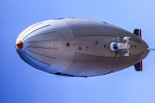 Pompano, Florida, USA – October 20, 1984 – A vertical image of the bellyside of the Goodyear Blimp Enterprise N1A, which was stationed at Pompano Air Park in South Florida. The Blimp color scheme logo was changed in 1991.