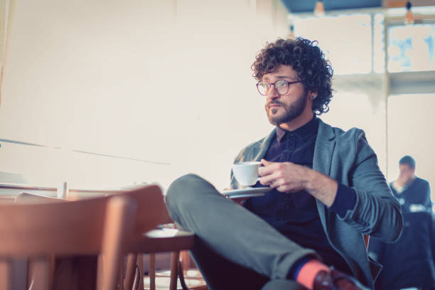 istock Man sitting in the coffee shop and using phone 1125379597