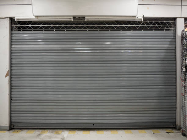 istock close shutter or rolling door of shop background with copy space 1125379813