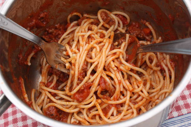 istock Spaghetti with Bolognese sauce in preparation 1125381015