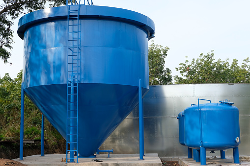 blue large fresh industrial water tank in rural area