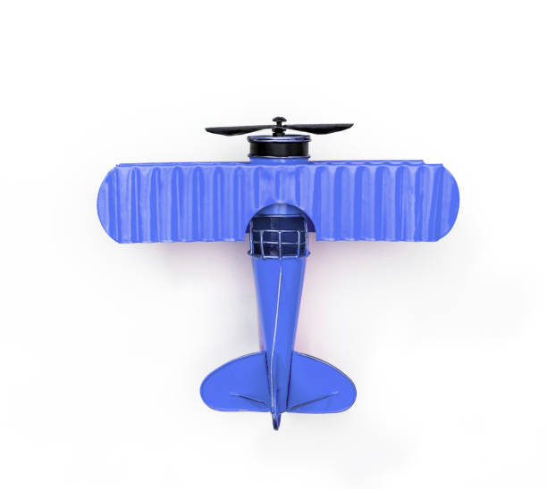 istock blue Metal toy plane isolated on white 1125382951