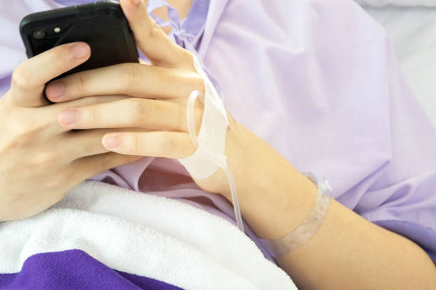 istock Patient hold smartphone in his hand. 1125383387