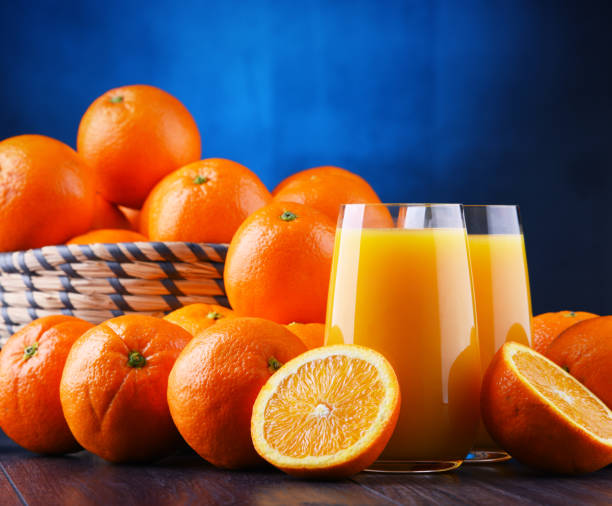 istock Glasses with freshly squeezed orange juice 1125383407