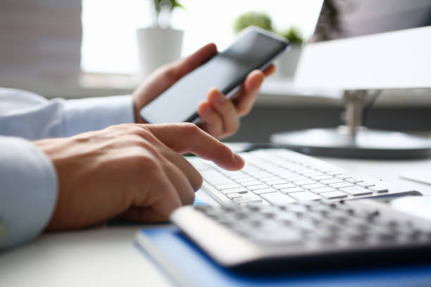 istock Businessman hipster holds telephone background of 1125384965