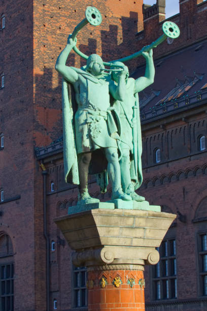 Twin Viking Trumpeters June 26, 2018- Copenhagen, Denmark: The green statues of the Lur Blowers and their horns lur stock pictures, royalty-free photos & images