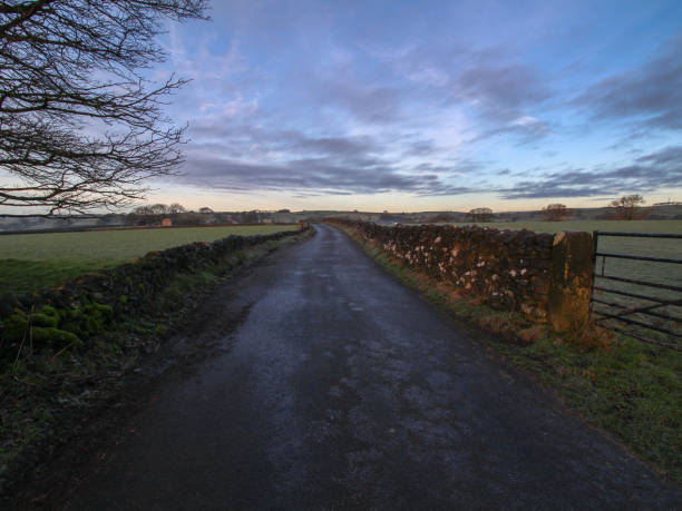 istock Peak District National Park deserted lane, Tideswell Litton 1125390180