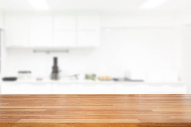 istock Empty wooden and table on abstract white modern kitchen background with shelf, product display, Ready for product montage 1125390200