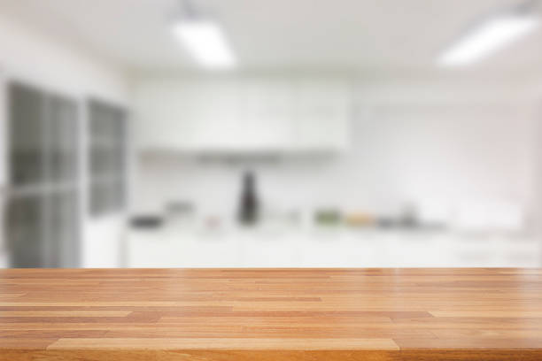 istock Empty wooden and table on abstract white modern kitchen background with shelf, product display, Ready for product montage 1125390213