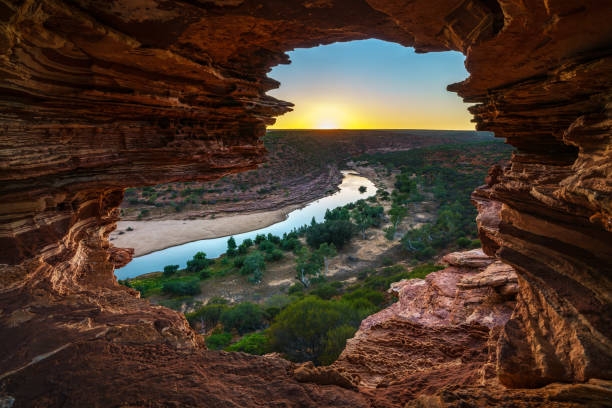 sunrise at natures window in kalbarri national park, western australia 2 sunrise at natures window in the desert of kalbarri national park, western australia western australia stock pictures, royalty-free photos & images