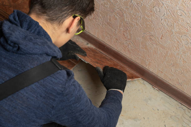 istock A man installs ceramic tile in the hallway 1125396122