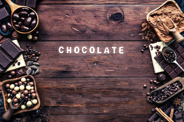 istock Assorted chocolate in old fashioned style with copy space frame and sign 1125396985