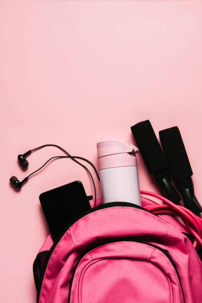 istock Sports bag and accessories on pink background 1125401815