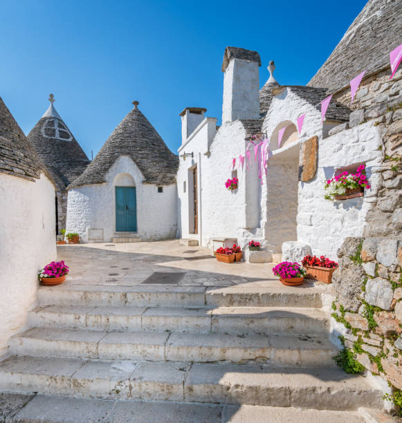 Scenic sight in Alberobello, the famous Trulli village in Puglia (Apulia), southern Italy. Scenic sight in Alberobello, the famous Trulli village in Puglia (Apulia), southern Italy. alberobello stock pictures, royalty-free photos & images