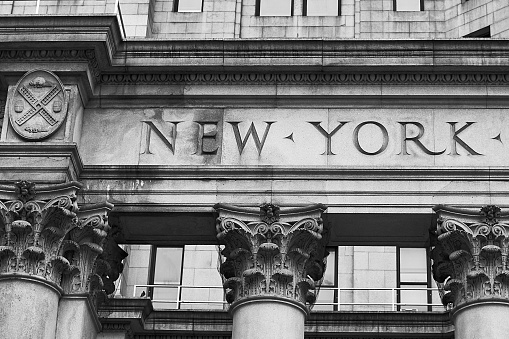 Word New York on the old building facade in NYC, USA