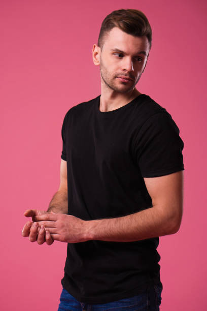 istock Confident man in black t-shirt 1125411362