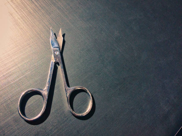 istock small nail scissors on a dark background, nail scissors, small scissors, dark background 1125412093