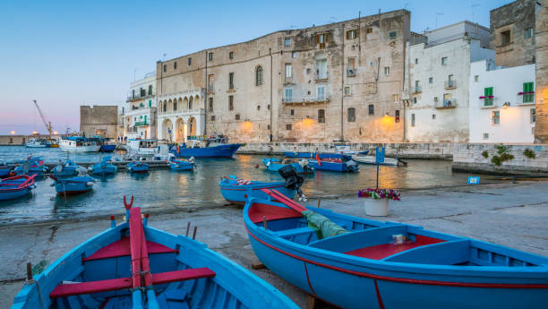 Old harbour in Monopoli at sunset, Bari Province, Puglia (Apulia), southern Italy. Old harbour in Monopoli at sunset, Bari Province, Puglia (Apulia), southern Italy. monopoli puglia stock pictures, royalty-free photos & images