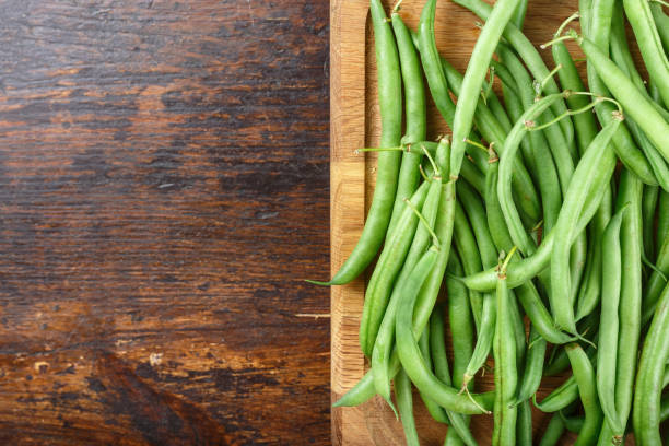 istock asparagus beans on a cutting board on the kitchen table. 1125413638