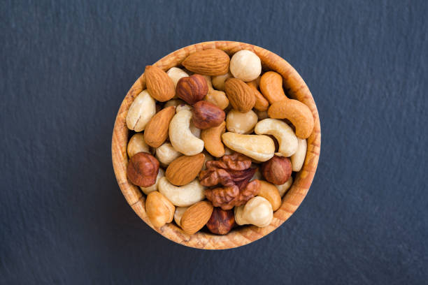 istock Various nuts on stone background. Concept healthy snack. 1125415006