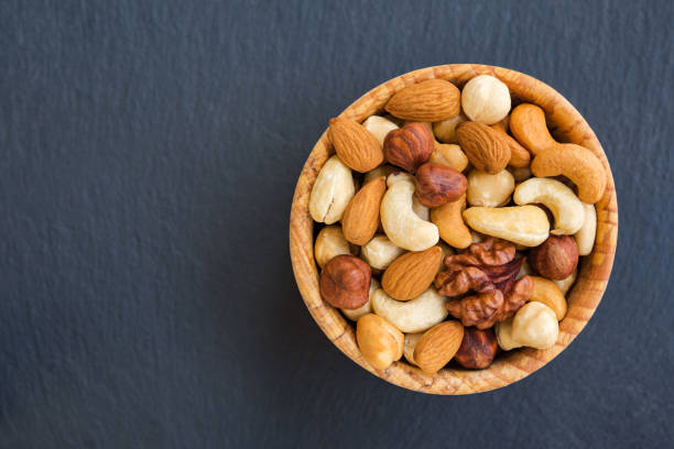 istock Organic mix nuts on stone background. Concept healthy snack. 1125415089