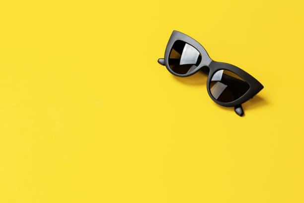 istock Women's retro sunglasses cat or fox on a bright yellow background. 1125415525